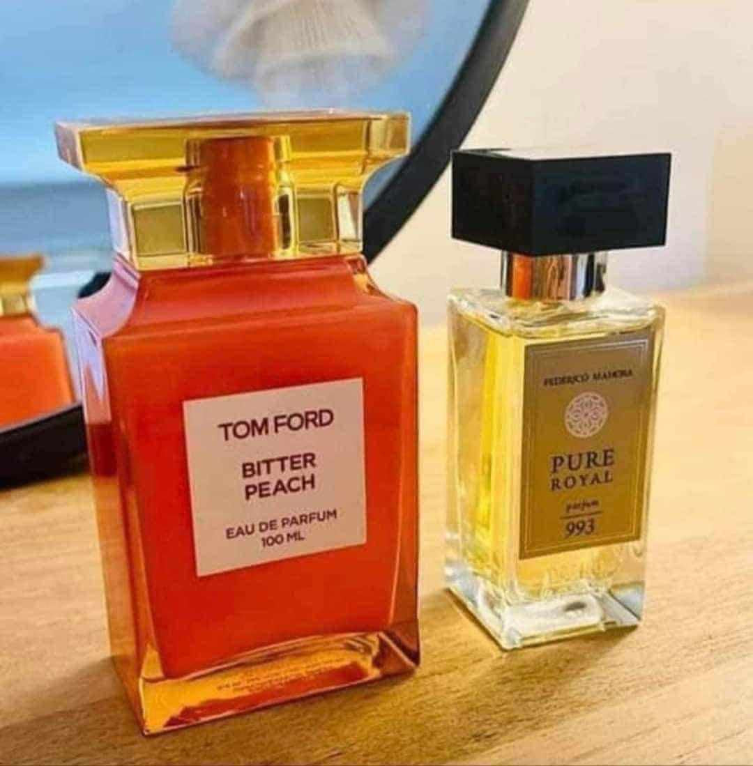 Parfum Unisex PURE ROYAL 993 50ml bottle with sensual fragrance notes, next to Tom Ford Bitter Peach.