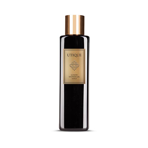 Utique Luxury Shower Gel Gold bottle against white background.